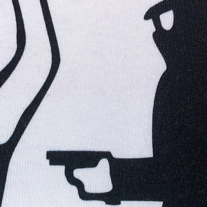 CALMECS T-SHIRT IN COLOR WHITE WITH RED FONT AND BLACK GRAPHIC FRONT PRINT. CLOSE UP CRIME.