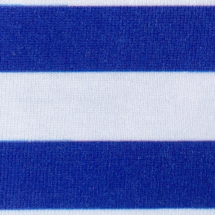 CALMECS T-SHIRT IN COLOR WHITE WITH RED AND BLUE BACK GRAPHIC PRINT. BLUE CLOSE UP.
