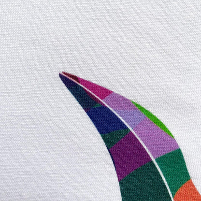 CALMECS T-SHIRT IN COLOR WHITE WITH COLORFUL ANGEL FRONT PRINT. CLOSE UP ANGEL WING.