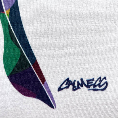 CALMECS T-SHIRT IN COLOR WHITE WITH COLORFUL ANGEL FRONT PRINT. CLOSE UP CALMECS FONT.